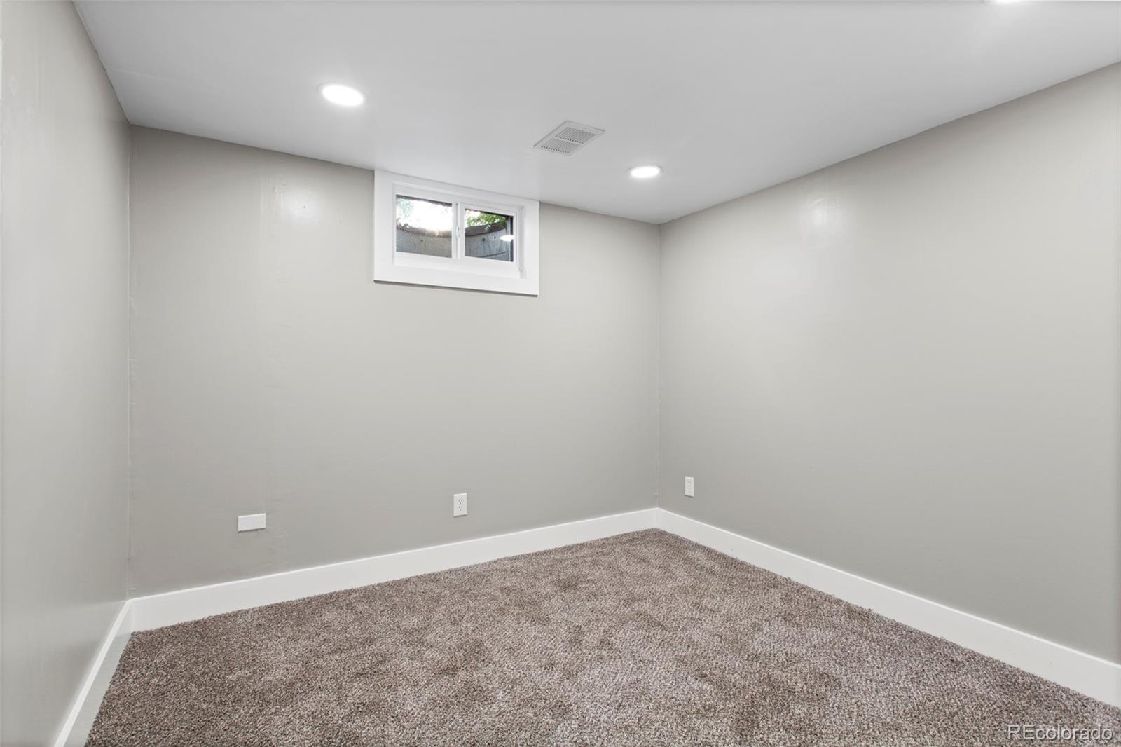 8060 Stuart Place Westminster, CO 80031 - Photo 11 of 18 an empty room with a workbench