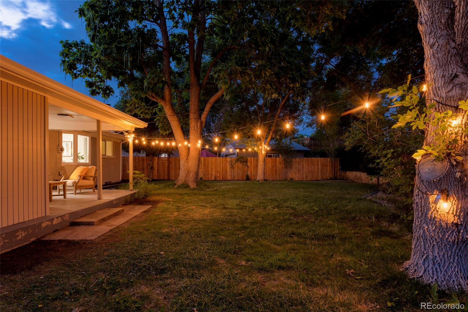 8060 Stuart Place Westminster, CO 80031 - Photo 18 of 18 a row of trees with a yard