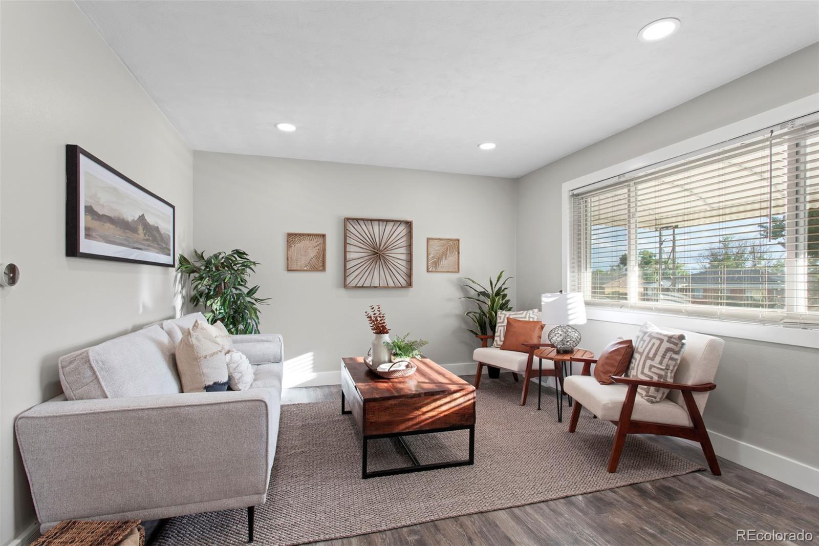8060 Stuart Place Westminster, CO 80031 - Photo 3 of 18 a living room with furniture and a large window