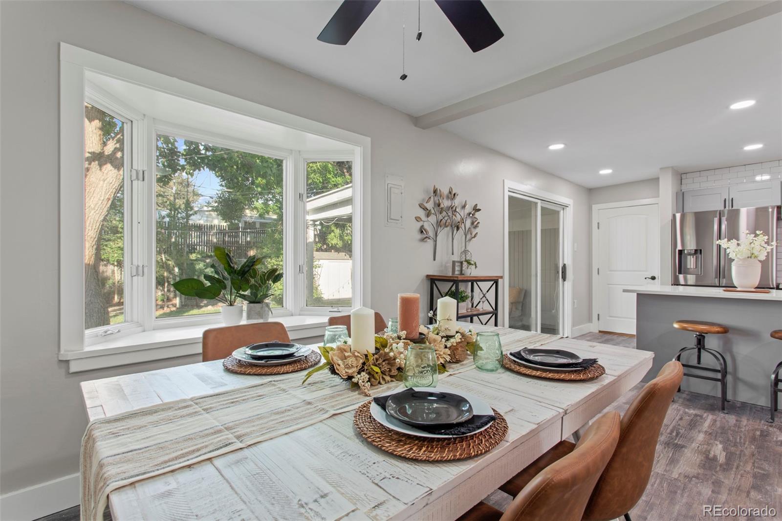 8060 Stuart Place Westminster, CO 80031 - Photo 6 of 18 a living room with furniture and a large window