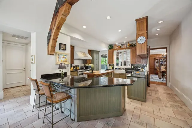 a kitchen with counter top space and appliances