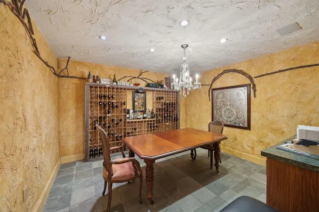 a room with table chairs and wooden floor