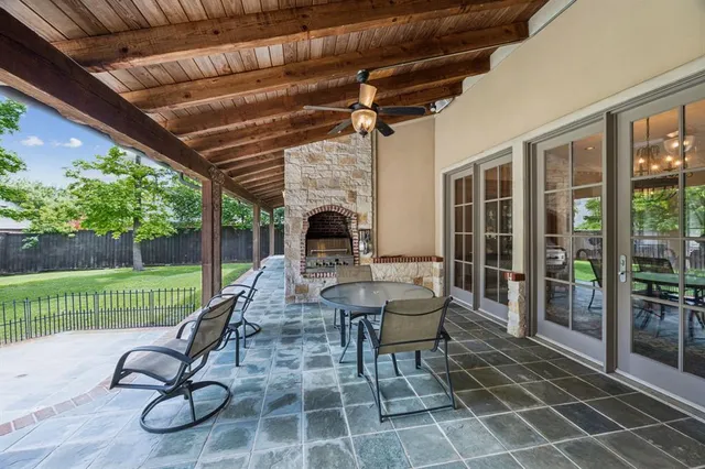 a view of a porch with furniture and garden