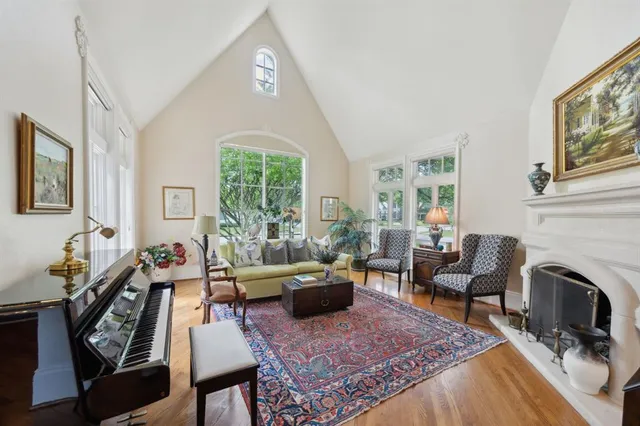 a living room with furniture windows and a fireplace