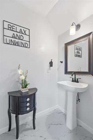 a view of a room with a table and chairs