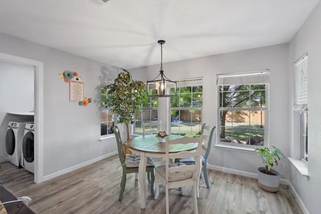 a dining room with furniture window wooden floor
