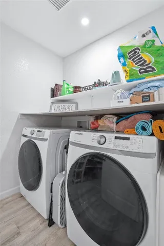 a utility room with dryer and washer