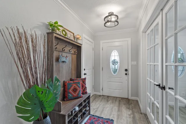 a view of an entryway with wooden floor