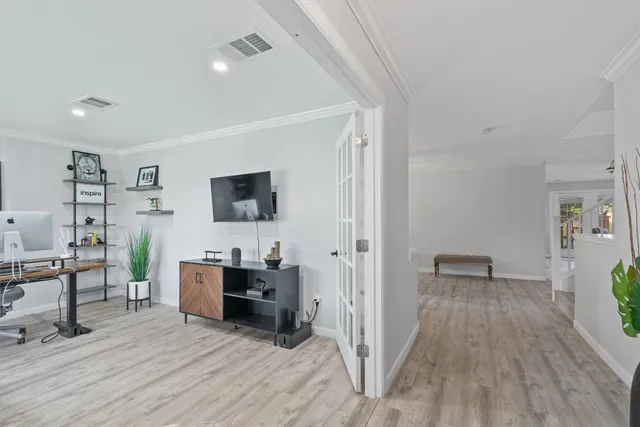 a view of a livingroom with furniture and wooden floor