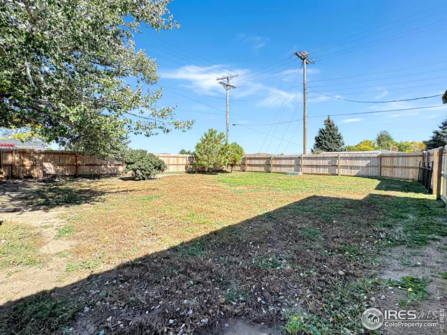 a view of a swimming pool with a yard