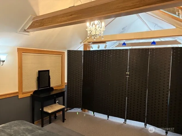 a room that has a bed and a television