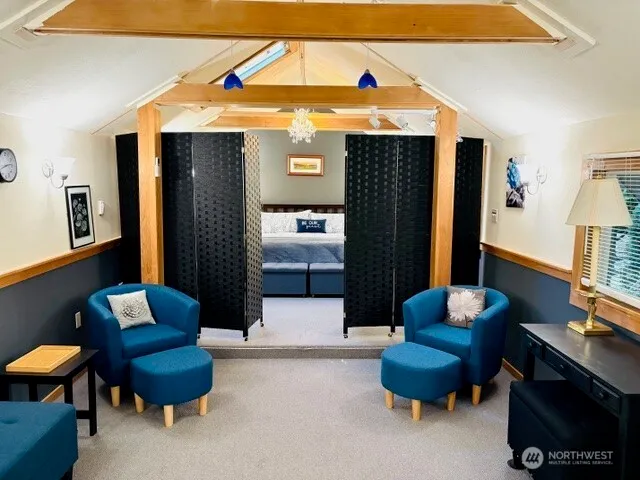 a living room with furniture and a chair