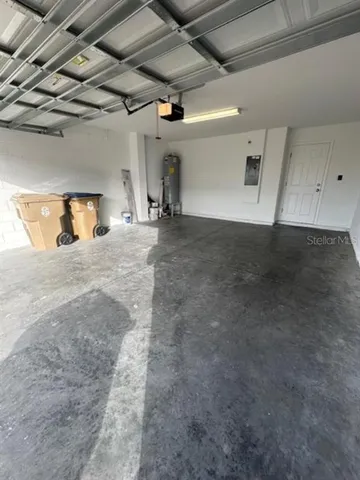 a view of a empty room with windows