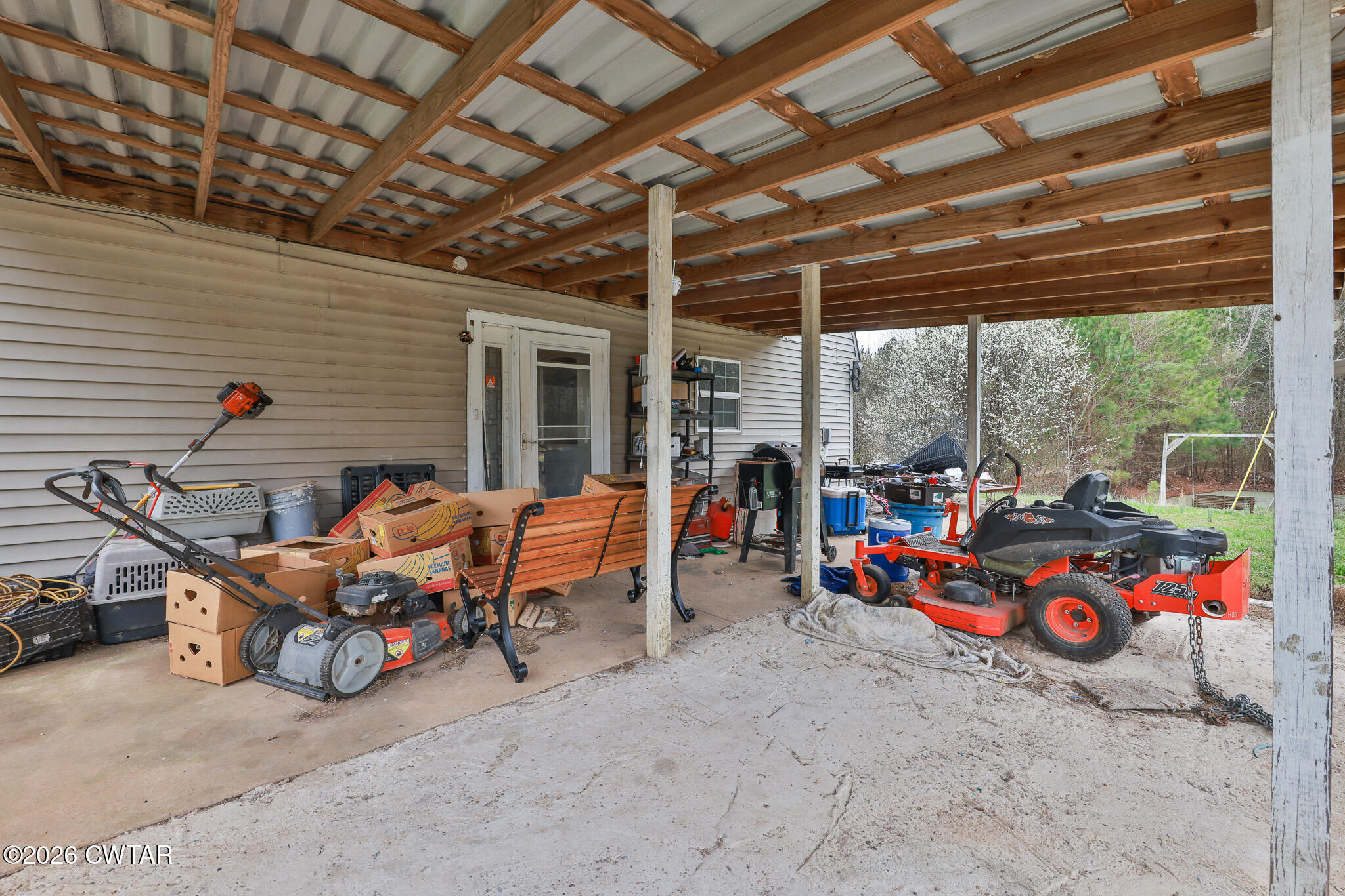 840 School Road Palmersville, TN 38241 - Photo 15 of 27 a backyard of a house with table and chairs