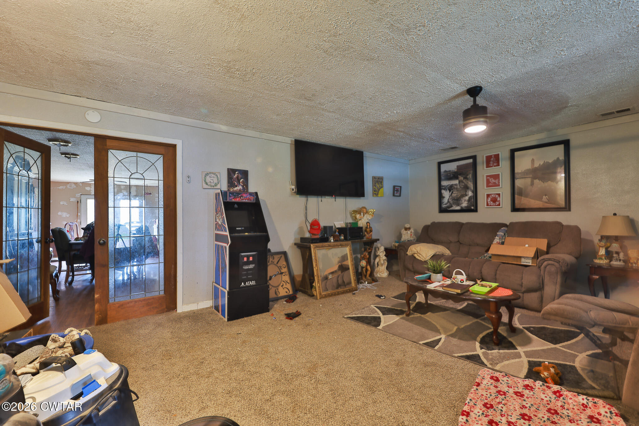 840 School Road Palmersville, TN 38241 - Photo 5 of 27 a room with gym equipment and a flat screen tv