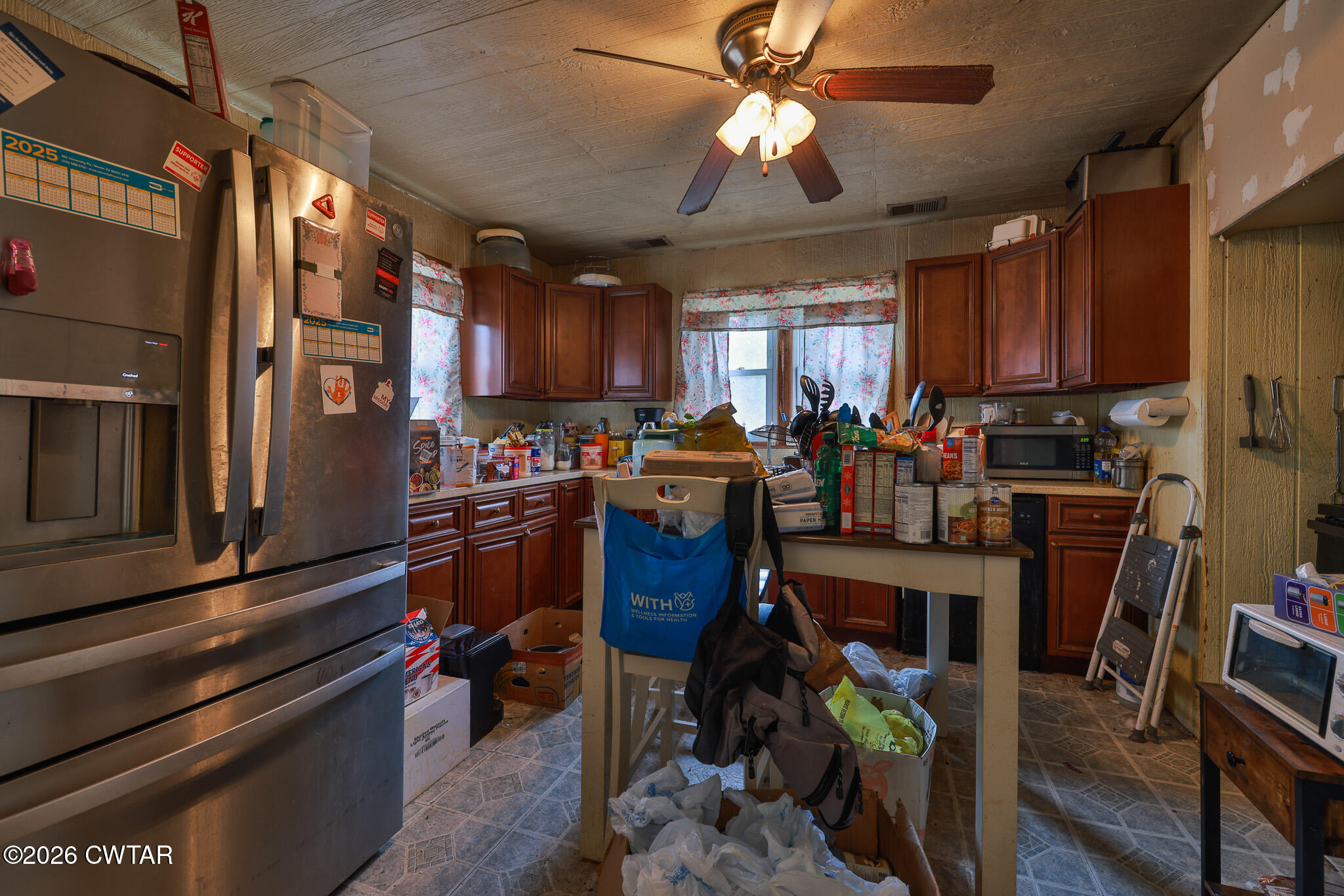 840 School Road Palmersville, TN 38241 - Photo 6 of 27 a view of a kitchen with stainless steel appliances granite countertop a refrigerator a stove a sink dishwasher and a dining table with the kitchen view