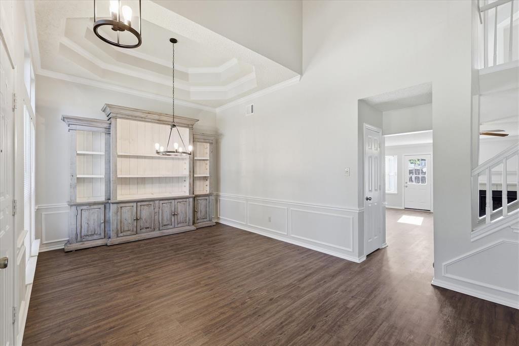 318 Lodge Road Coppell, TX 75019 - Photo 6 of 35 The spacious dining room opens beautifully to the entry and main living areas, offering an inviting flow for entertaining.