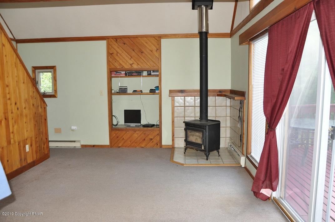 1041 Clover Road South Long Pond, PA 18334 - Photo 7 of 26 a view of an empty room with large windows