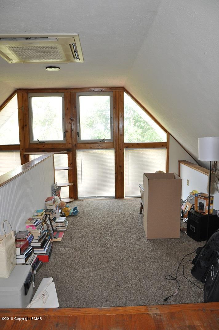 1041 Clover Road South Long Pond, PA 18334 - Photo 10 of 26 a room with gym equipment and a large window