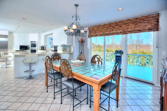 a dining room filled a table and chairs