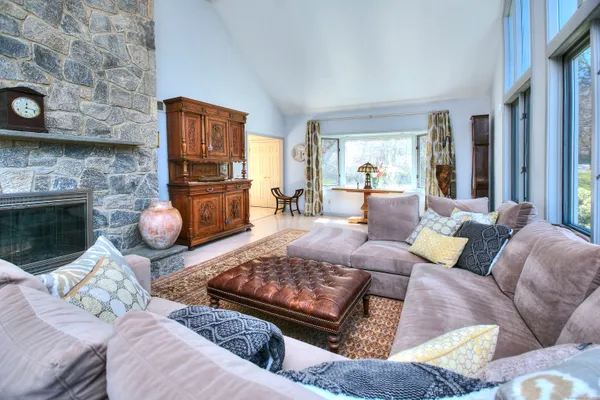 a living room with furniture and a fireplace