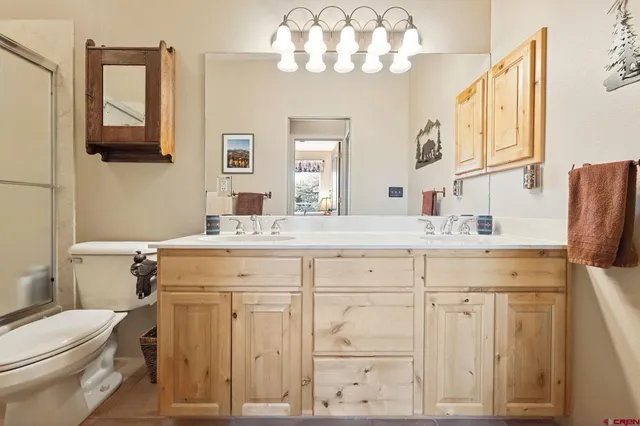 a bathroom with a sink vanity and a mirror