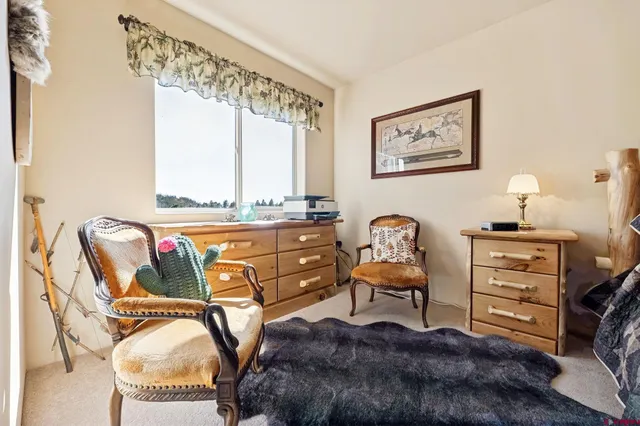 a living room with furniture and window