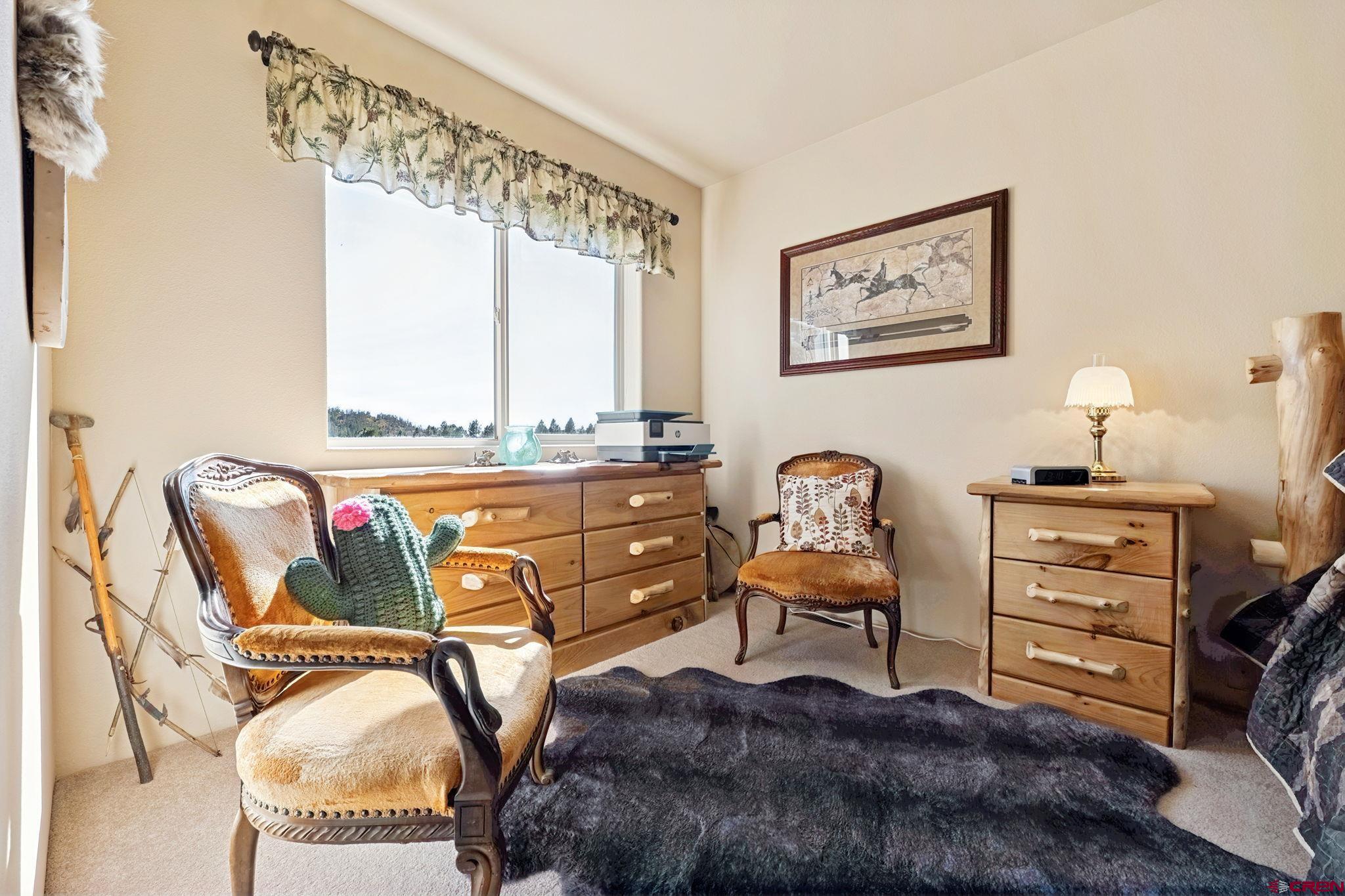55 Edgemont Way Durango, CO 81301 - Photo 17 of 27 a living room with furniture and window