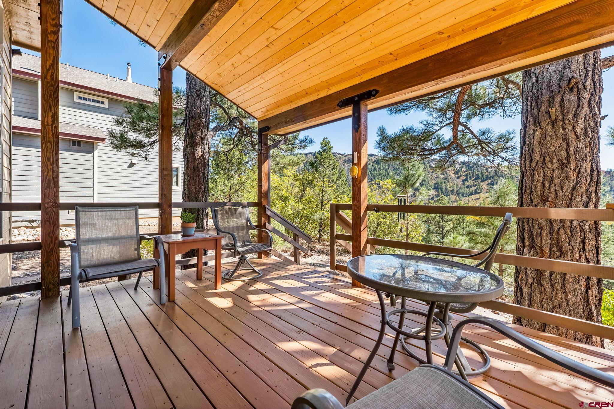 55 Edgemont Way Durango, CO 81301 - Photo 19 of 27 a view of a chairs and table on the deck