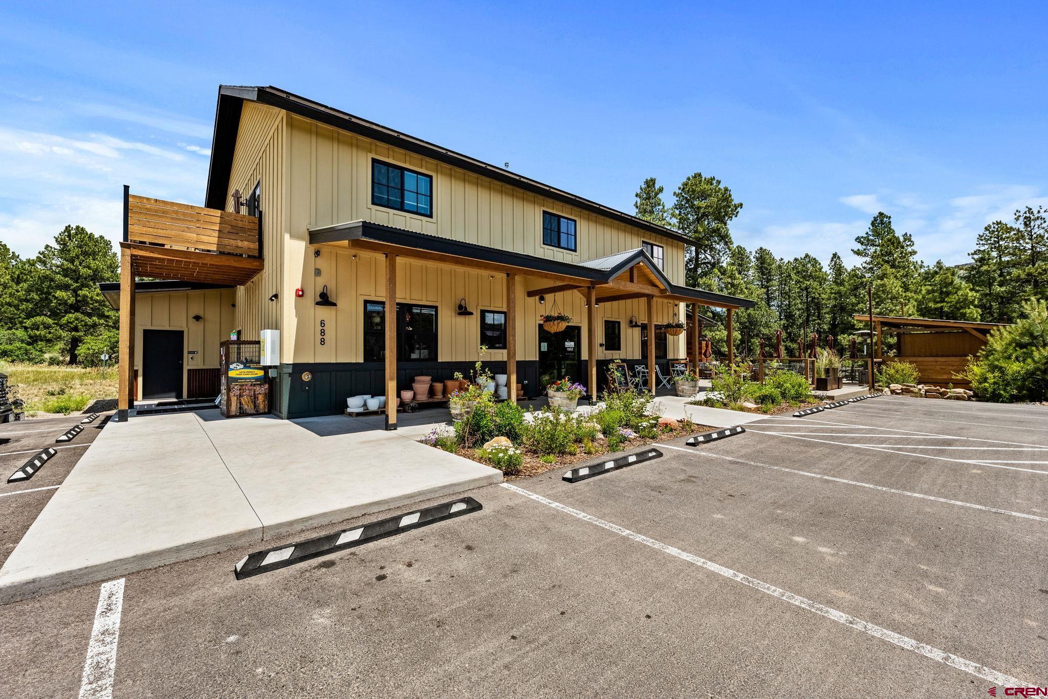 55 Edgemont Way Durango, CO 81301 - Photo 27 of 27 a front view of a building with sitting area