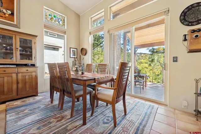 a view of a dining room with furniture and chandelier