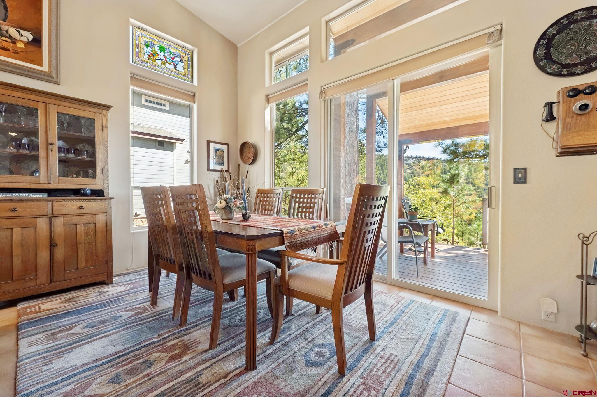 55 Edgemont Way Durango, CO 81301 - Photo 4 of 27 a view of a dining room with furniture and chandelier
