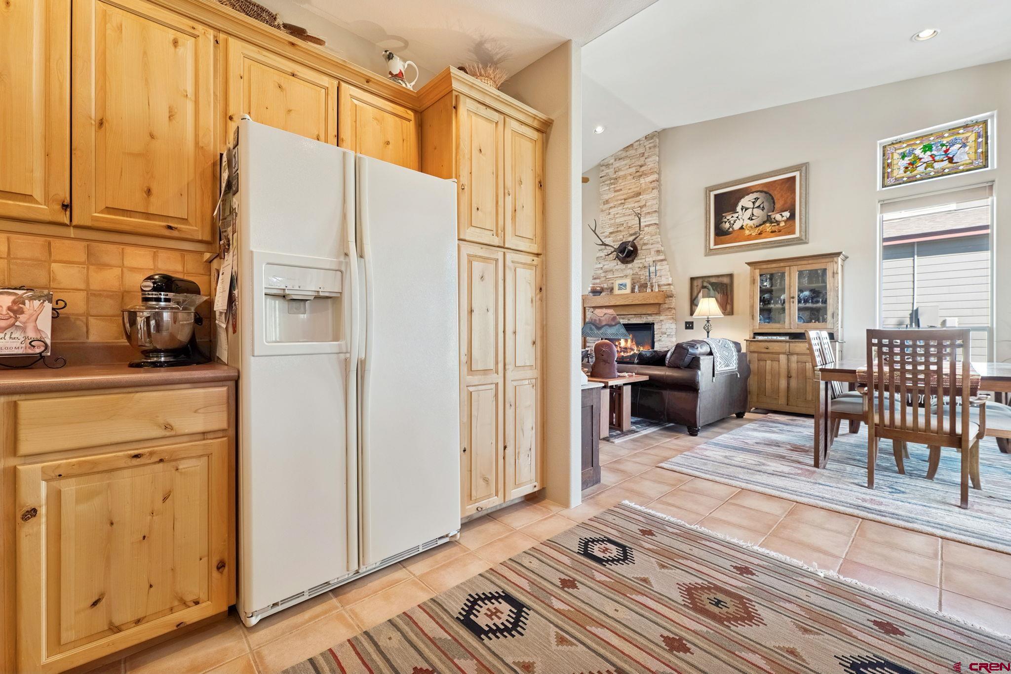 55 Edgemont Way Durango, CO 81301 - Photo 8 of 27 a living room with furniture a dining table and chairs with wooden floor