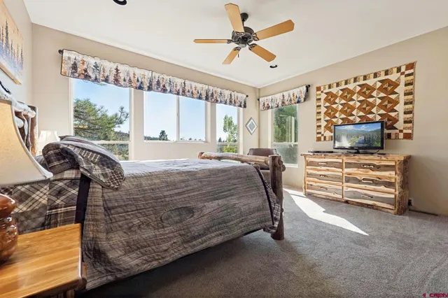 a bed sitting in a room next to a window