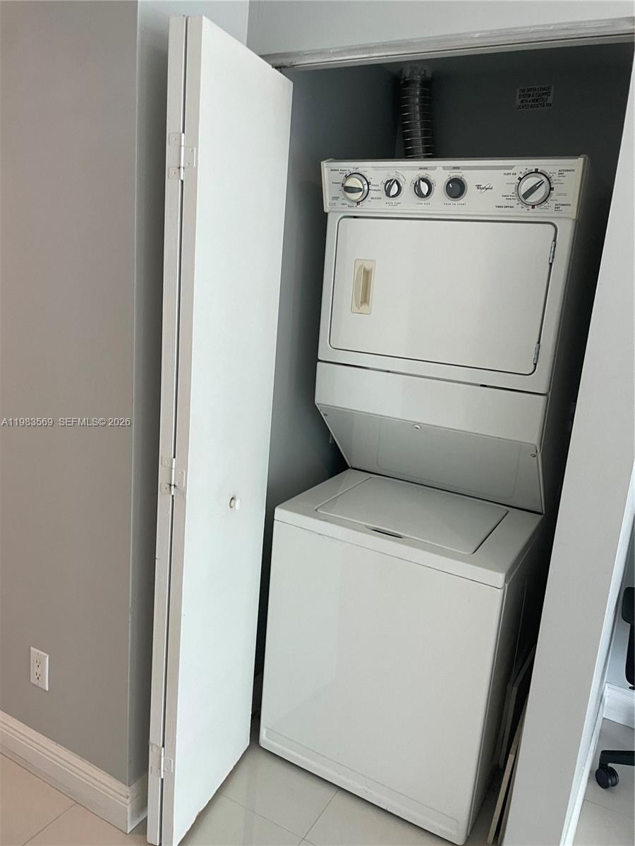 60 Southwest 13th Street, Unit 1806 Miami, FL 33130 - Photo 12 of 12 a utility room with dryer and washer