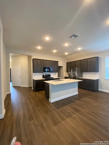 a view of kitchen with wooden floor