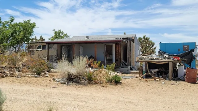 a front view of house with outdoor seating
