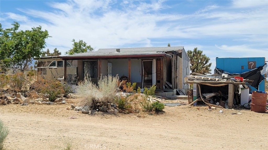 18501 Fort Tejon Road Llano, CA 93544 - Photo 11 of 19 a front view of house with outdoor seating