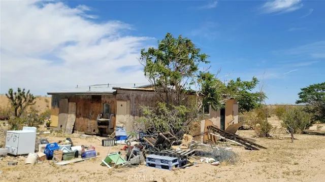 a view of a chairs and table in the patio