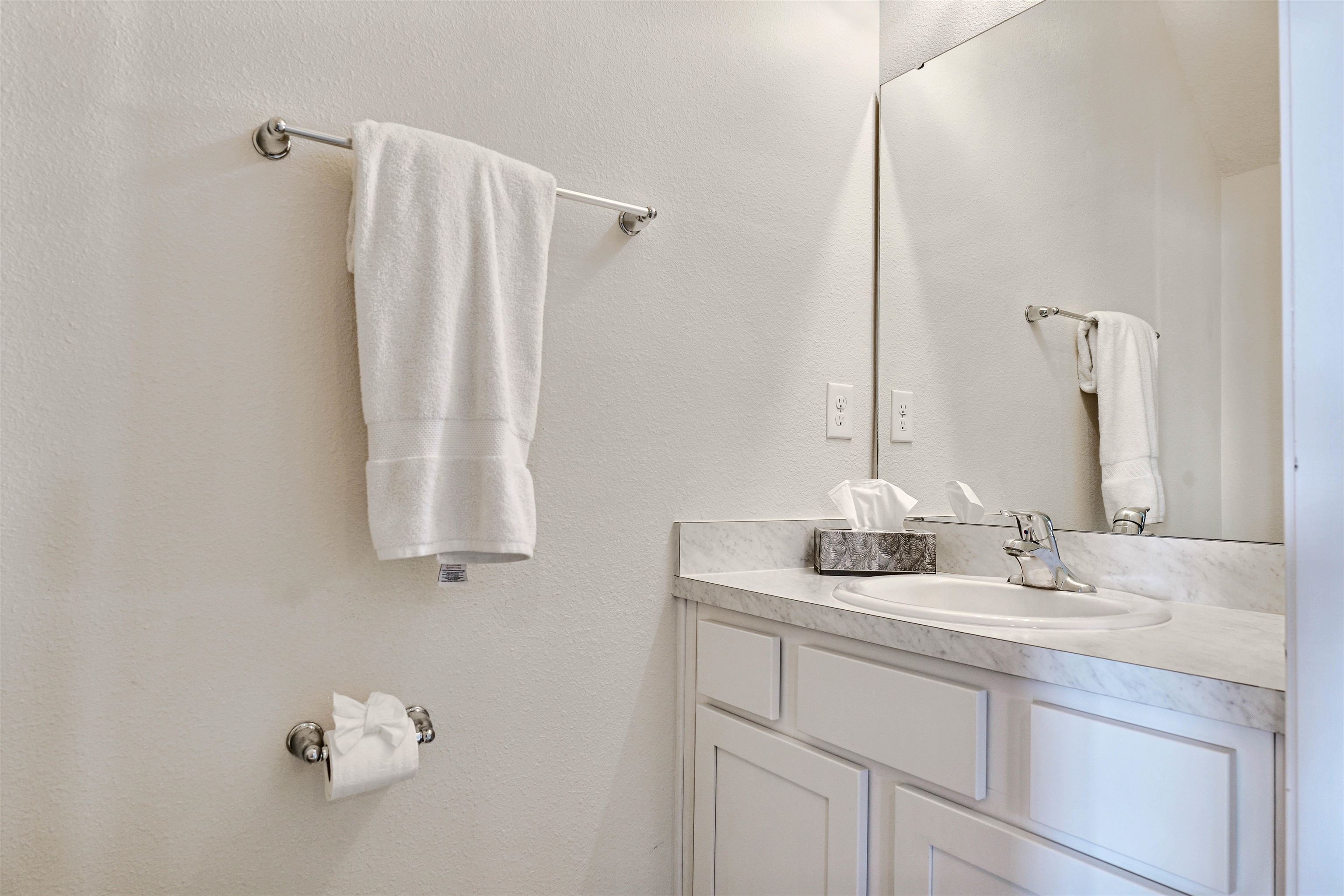 297 Coastline Way Street St. Augustine, FL 32092 - Photo 12 of 36 a bathroom with a sink and a mirror
