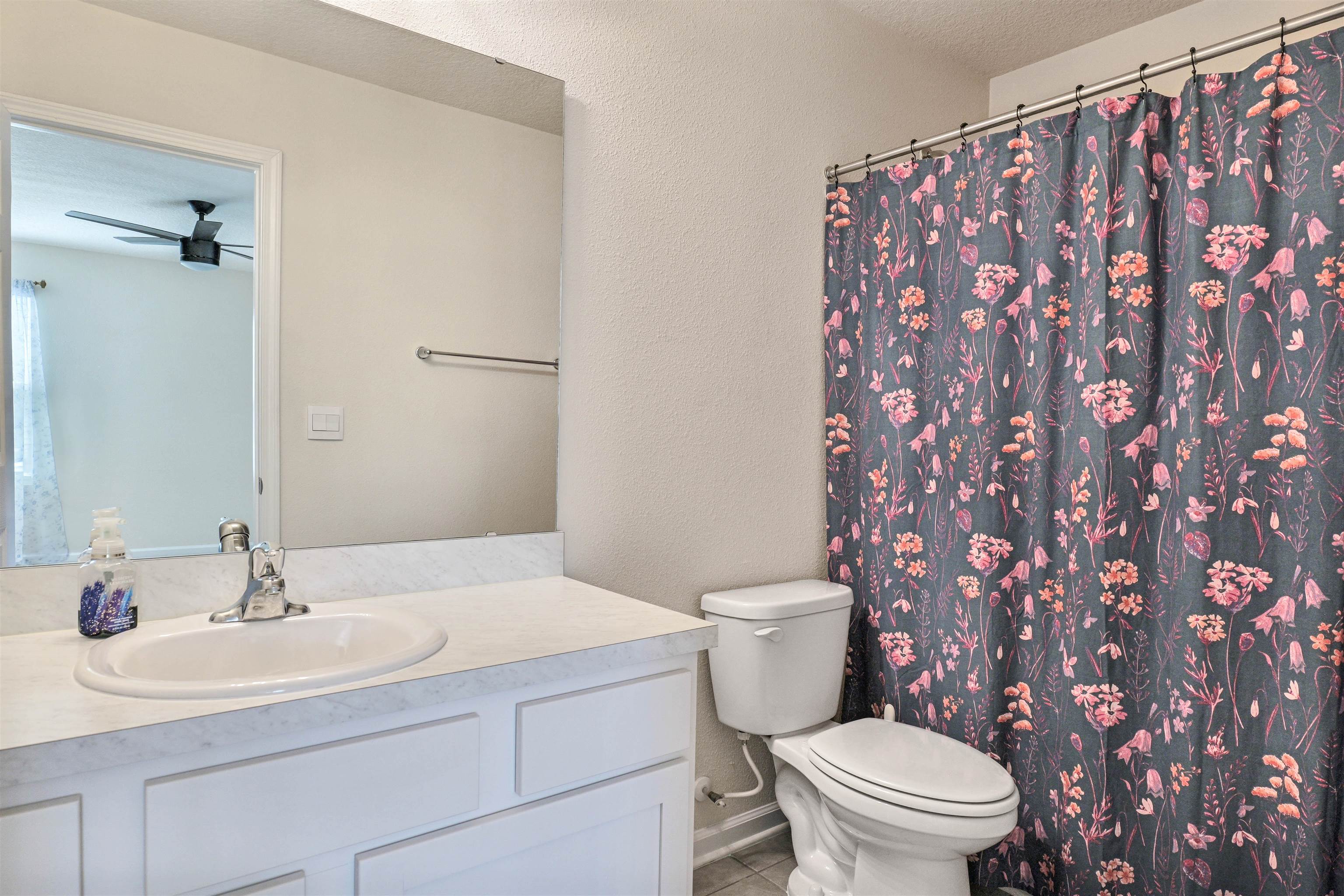 297 Coastline Way Street St. Augustine, FL 32092 - Photo 16 of 36 a bathroom with a sink toilet and a mirror