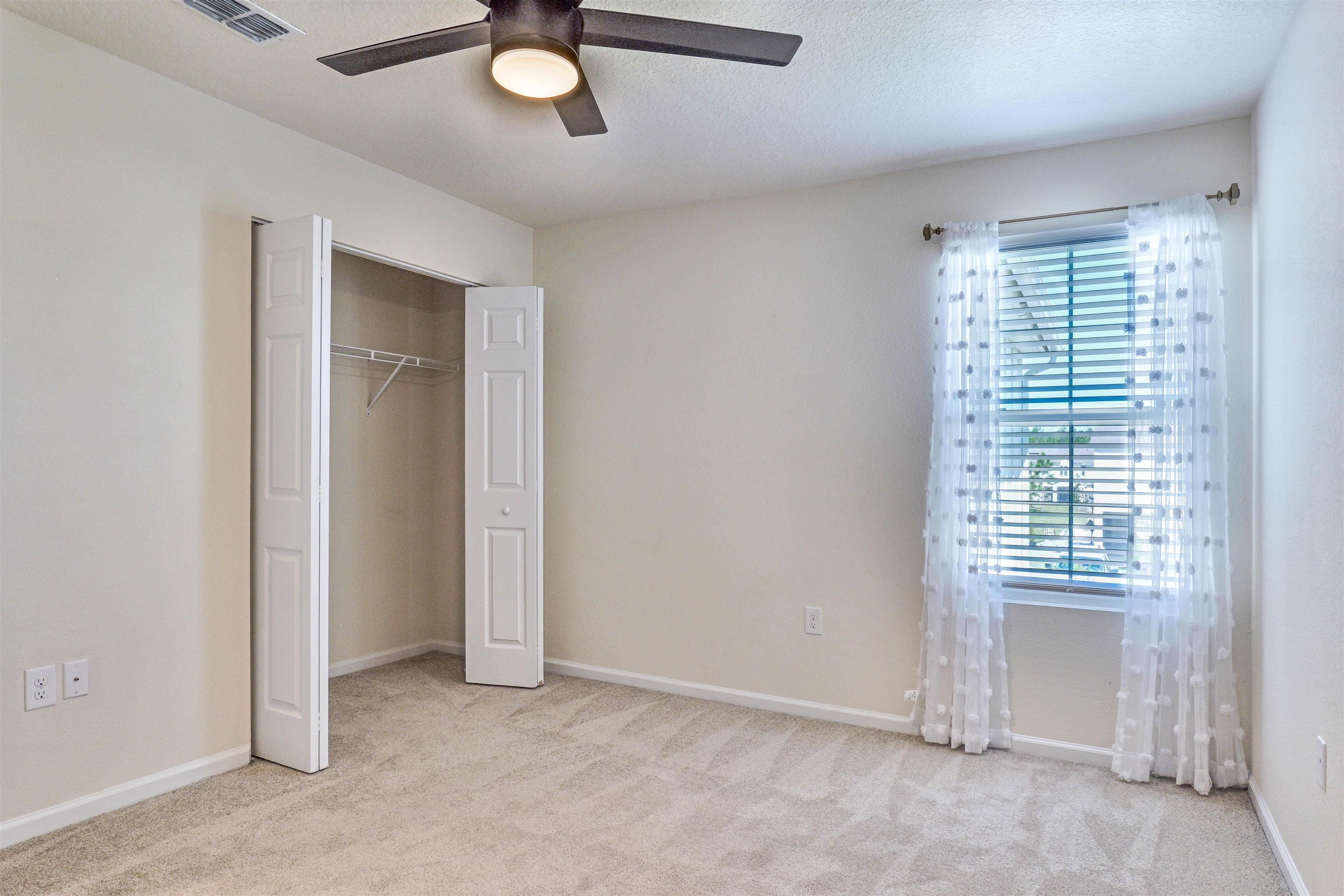 297 Coastline Way Street St. Augustine, FL 32092 - Photo 17 of 36 a view of an empty room with a window