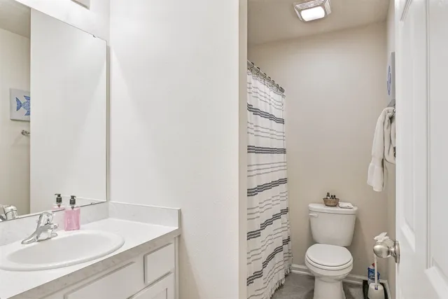 a bathroom with a toilet and a sink