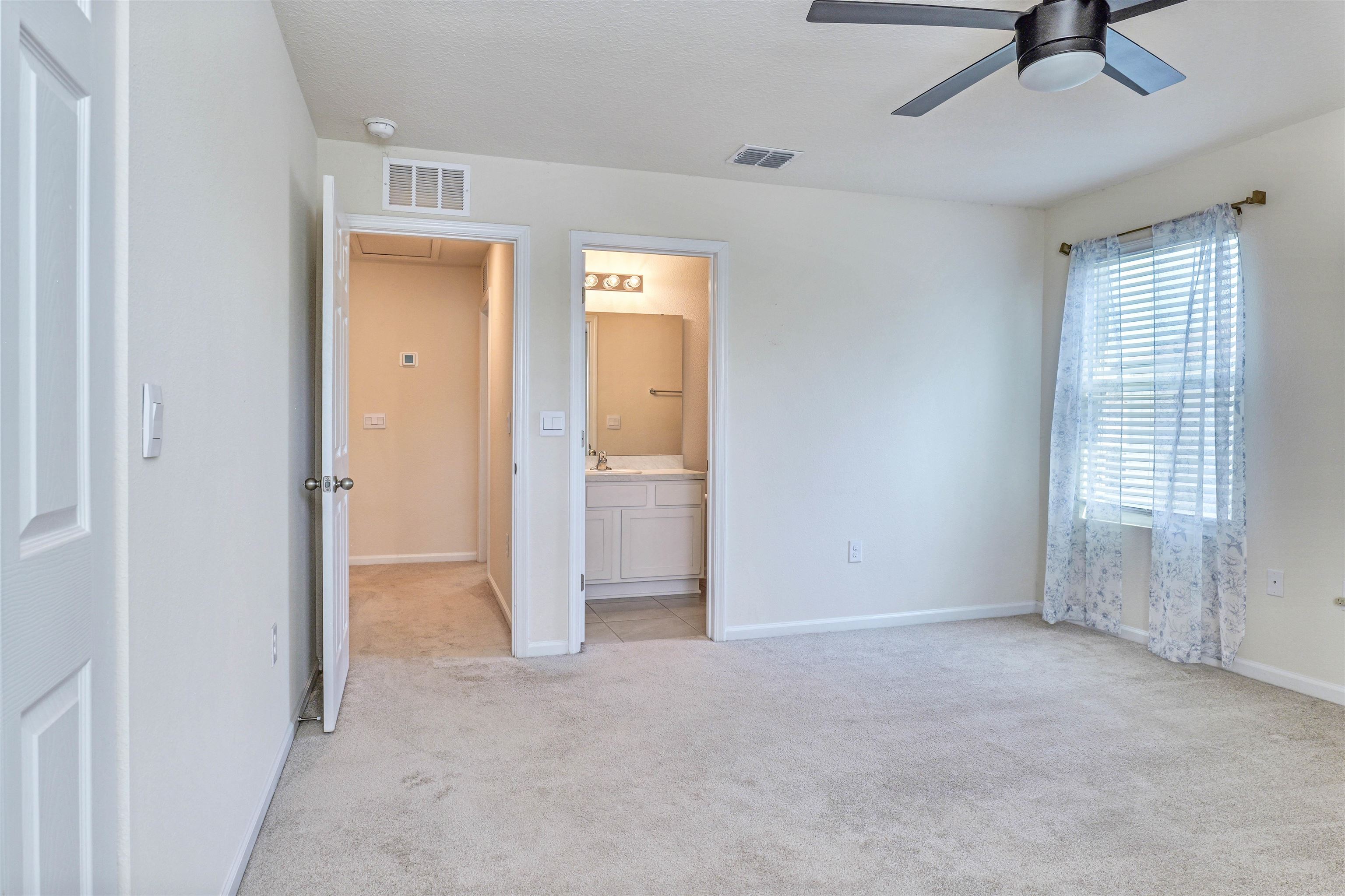 297 Coastline Way Street St. Augustine, FL 32092 - Photo 20 of 36 a view of an empty room with a window