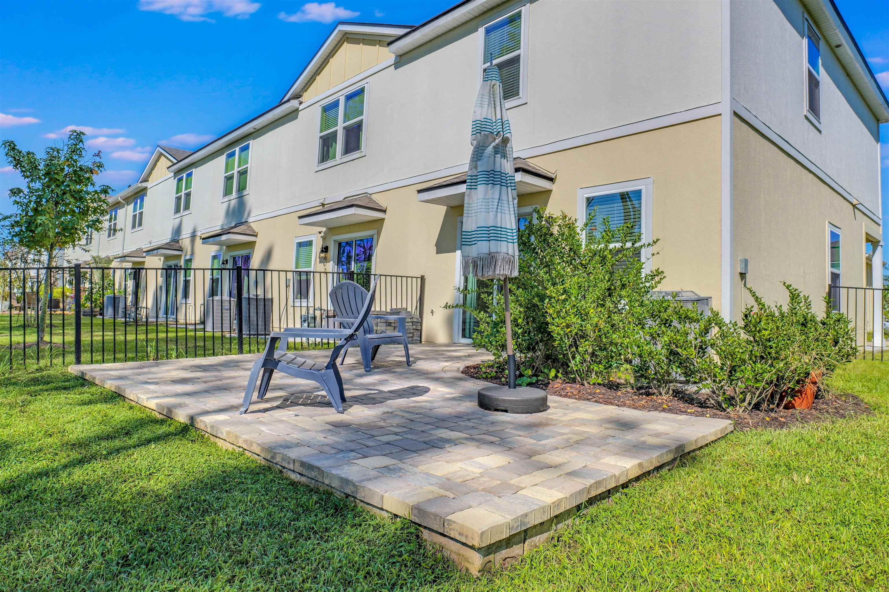 297 Coastline Way Street St. Augustine, FL 32092 - Photo 22 of 36 a view of a house with a yard and sitting area
