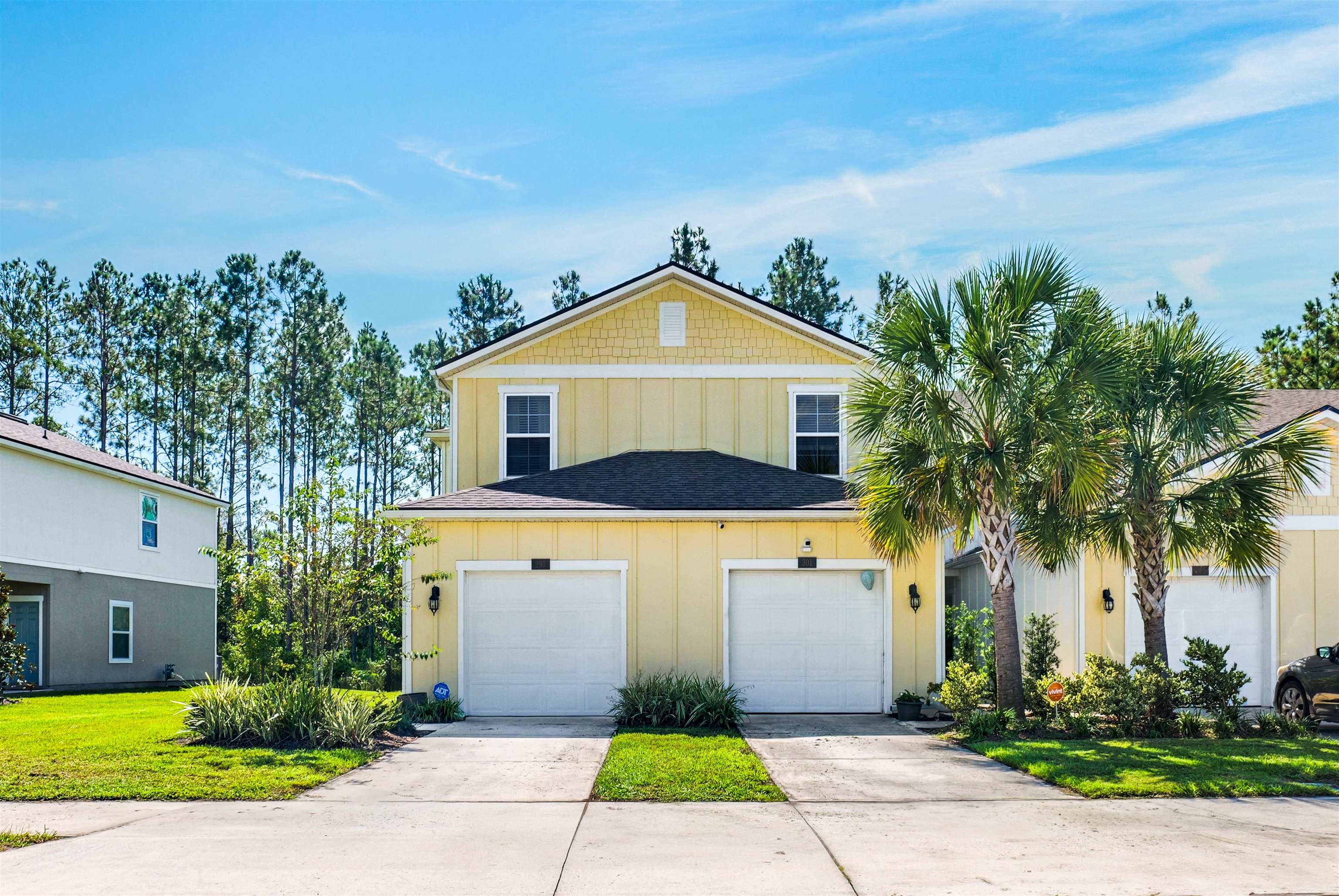 297 Coastline Way Street St. Augustine, FL 32092 - Photo 24 of 36 a front view of a house with garden