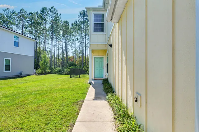 a view of a back yard with a house