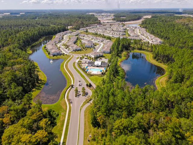 a view of a swimming pool and lounge chairs
