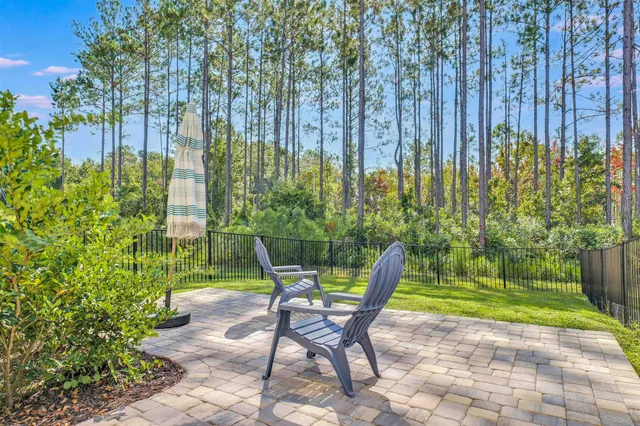 a view of a chairs in backyard of the house