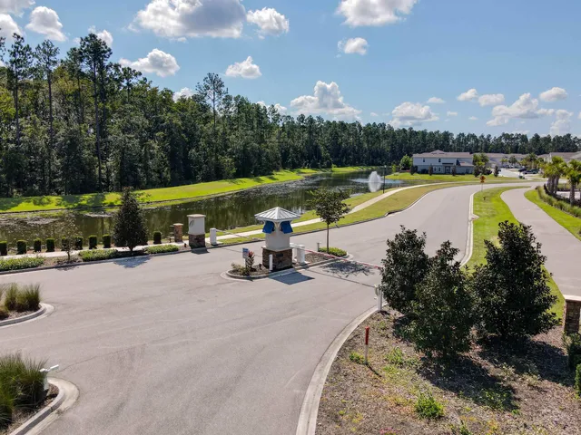an aerial view of a house with a swimming pool